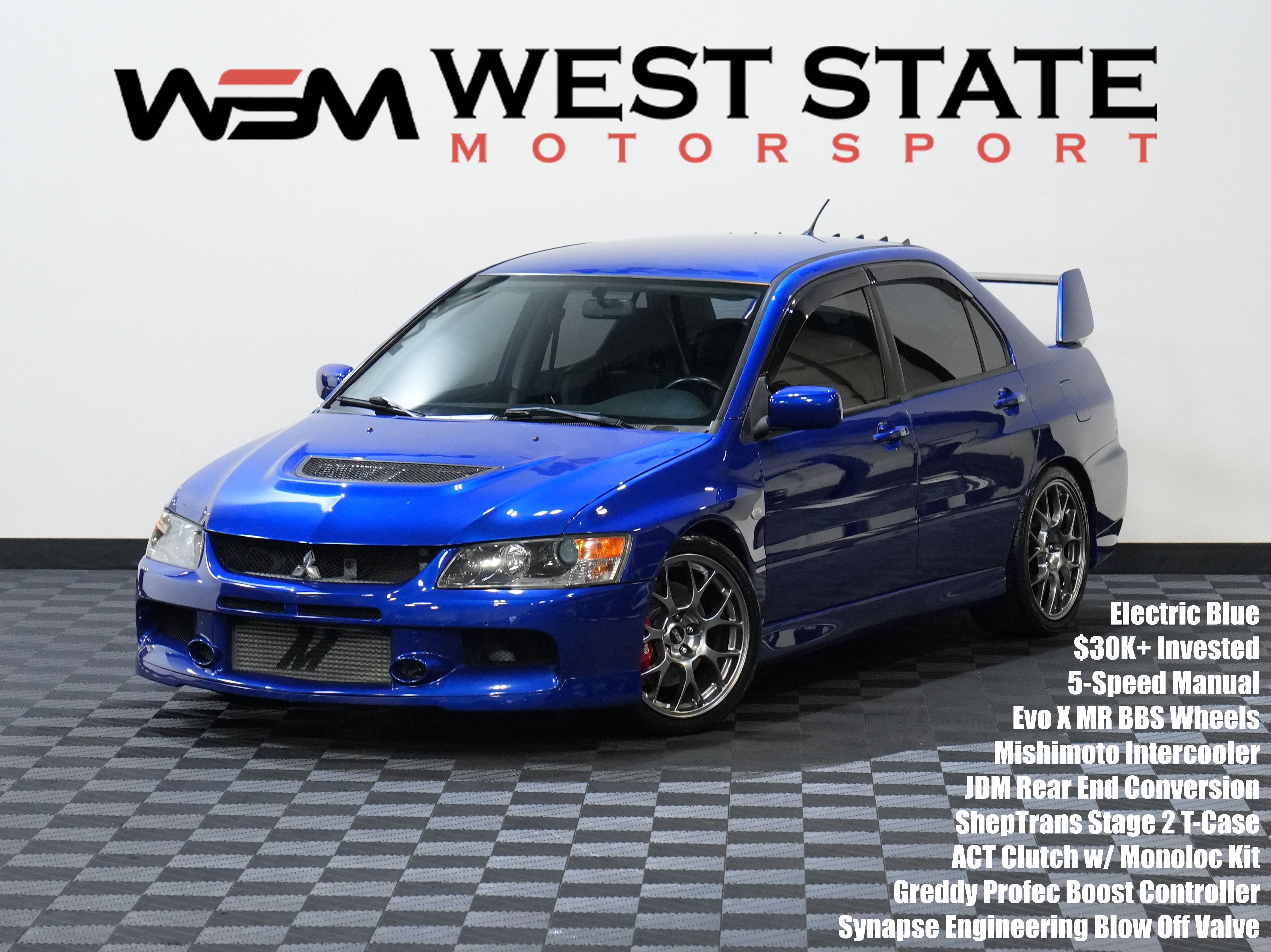 Blue 2006 Mitsubishi Lancer Evolution IX Sedan All-Wheel Drive 5-Speed Manual